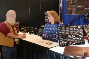 Education Specialist Kenyon Simpson (L) visiting with Michele Dougherty (R) of Empire Pewter