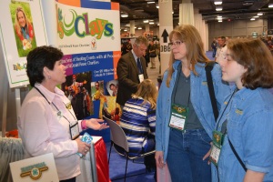 Lisa Muzzey (L), National 4-H Shooting Sports Committee meets with Colleen Kimble (C) and Logan Kimble-Lee (R) at the 2016 SHOT Show in Las Vegas, Nevada